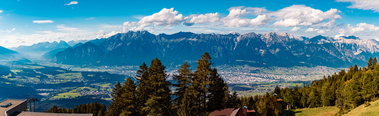 High resolution stitched alpine summer panorama with the city of Innsbruck in the background at Mount Patscherkofel, Tyrol, Austria - obrazy, fototapety, plakaty