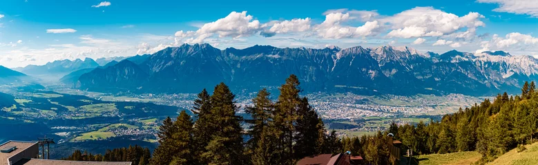 Foto auf Leinwand High resolution stitched alpine summer panorama with the city of Innsbruck in the background at Mount Patscherkofel, Tyrol, Austria © Martin Erdniss