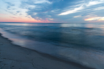 The silent sea in long exposure at sunset - 703974721