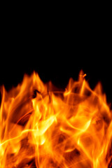 Fire flames isolated on a black backdrop. Abstract fire background.