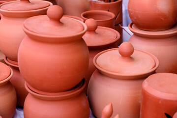 Collection of images with unglazed handmade pottery pot made of red clay. Teracota vase. Pottery...