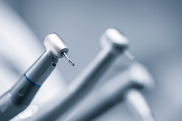 Dental equipment. Closeup photo of dental handpieces . Dental drills in dentists office - obrazy, fototapety, plakaty