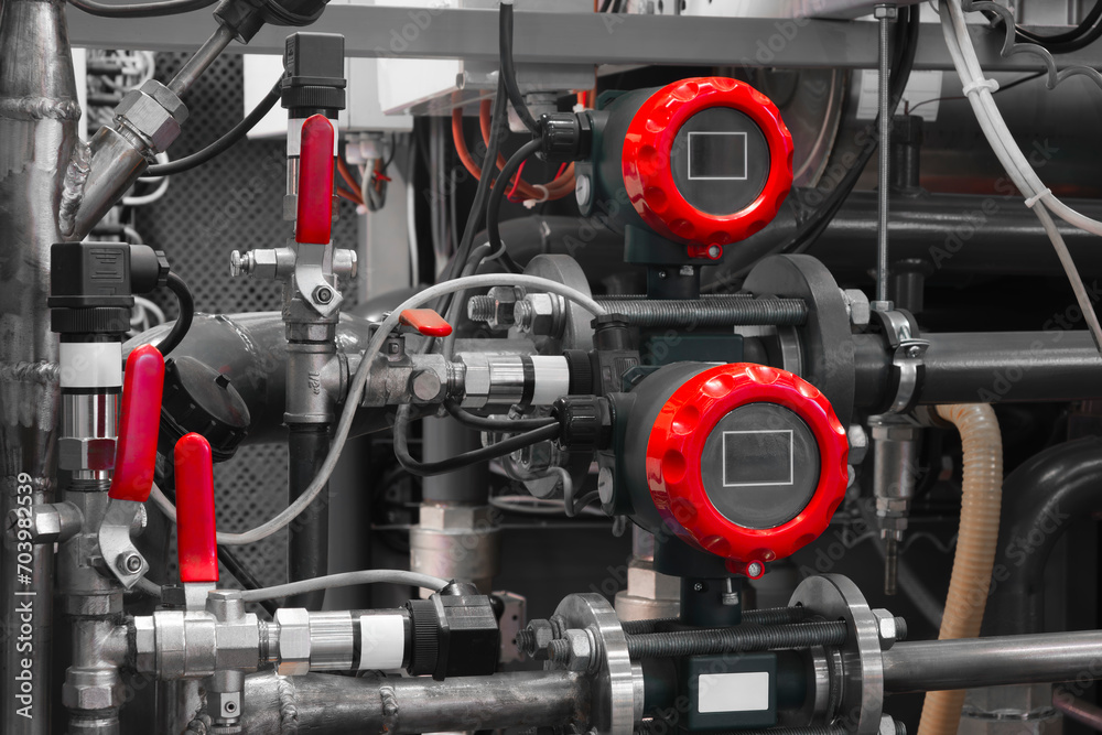 Poster pressure, temperature and flow sensors in an industrial boiler room. barometer in the heating system