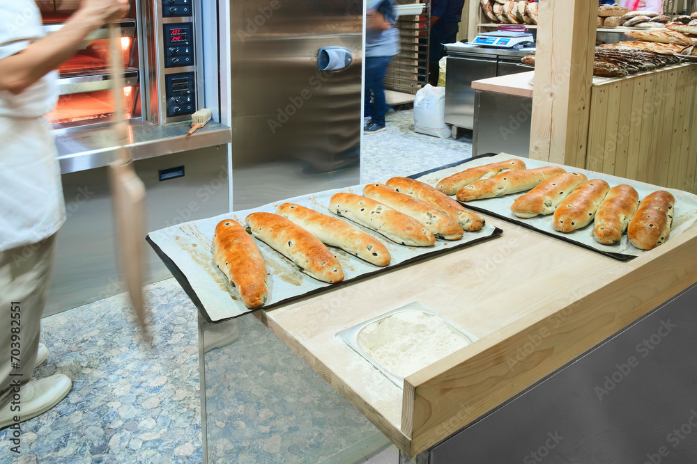 Poster baking bread in a modern bakery