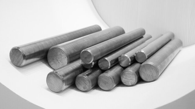 Metal bars with different round sizes in a row, metal construction concept background