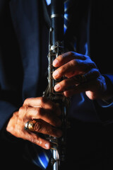 Hands playing clarinet