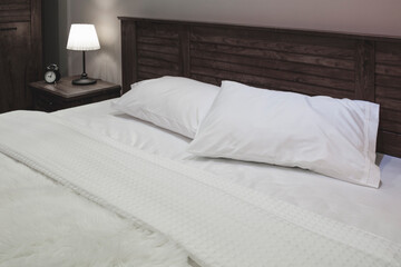 Fototapeta na wymiar Bedroom interior, modern look of bedroom interior in a hotel, apartment or home