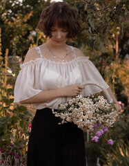 young lady walks in the garden