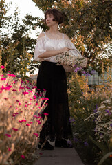 young lady walks in the garden