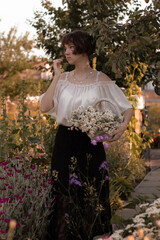 young lady walks in the garden