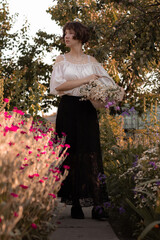 young lady walks in the garden