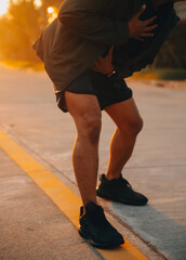 Athlete runner feet running on road, Jogging concept at outdoors. Man running for exercise..Athlete runner feet running on road, Jogging concept at outdoors. Man running for exercise.