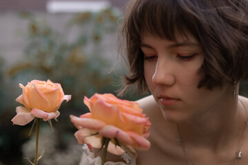 woman smelling a rose