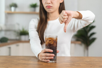 Diet, Dieting asian young woman, girl hand show thumb to refuse, deny drink sweet sparkling water a...