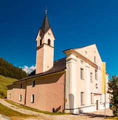 Fototapeta premium The famous Maria Waldrast monastery, Matrei am Brenner, Innsbruck, Tyrol, Austria on a sunny summer day