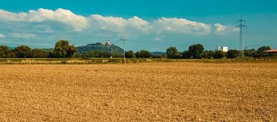 Fototapeta premium Agricultural summer view with Mount Bogenberg, Bogen, Danube, Bavaria, Germany