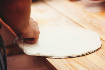 Cooking pizza in a pizzeria or restaurant