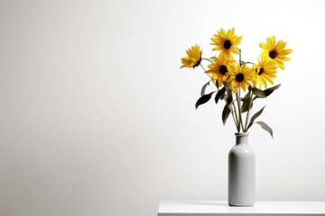  a white vase filled with yellow sunflowers on top of a white table and a white wall behind the vase is a white wall and there is a white wall behind the vase. - obrazy, fototapety, plakaty