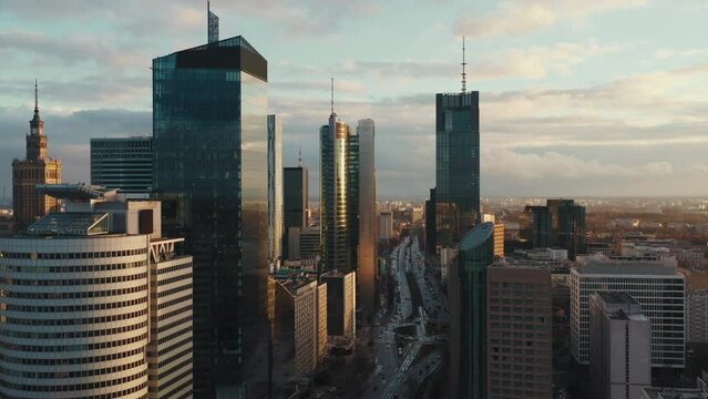 Aerial panorama of downtown glass skyscrapers. Cinematic drone shot morning cityscape skyline, high-rise modern architecture buildings, big city financial district, no logos and advertising billboards