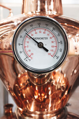 thermometer close-up on a copper tank distiller