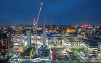 Leeds city centre aerial view at night with construction work at Wellington Street building new offices and apartments