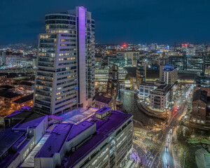 Fototapeta premium Leeds city centre West Yorkshire aerial view of the city centre at night looking north from near the train station