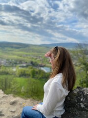 woman sitting on the rocks