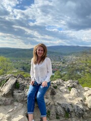 Naklejka premium woman on the top of mountain