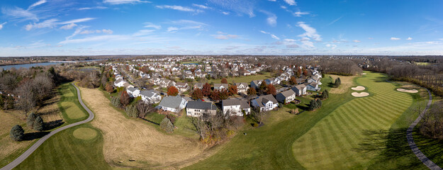 Aerial panoramic view of residential neighborhood and golf course in Powell, Ohio, USA.  November 24, 2023.