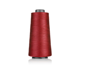 spool of industrial thread red, texture of thread on a white background