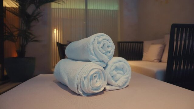 Clean white towels at a Parisian hotel, slow motion