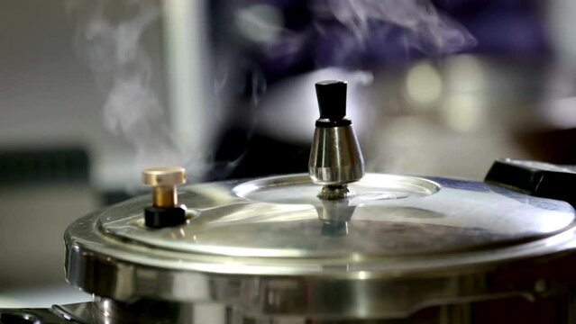 4K Ultra HD Video: Cooking Delight - Pressure Cooker Unleashing Flavors Through Pressure Valve