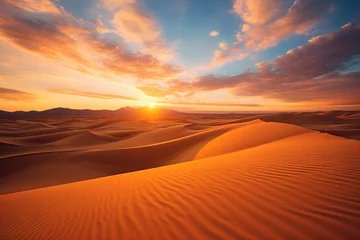   the sun sets over a desert landscape with sand dunes and mountains in the distance in the distance, with a few clouds in the sky, and a few clouds in the foreground. © Shanti