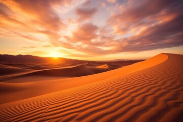  the sun is setting over a desert with sand dunes in the foreground and mountains in the distance in the distance, with a few clouds in the sky above the horizon.