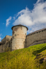 Old Kamianets-Podilskyi Castle under the blue sky. Part of the powerful bastions of the castle. The...