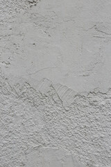 Vertical photo of plaster on the wall.