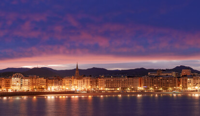 San Sebastian. Sunrise over La Concha Bay and the city of Donostia San Sebastian, Basque Country.