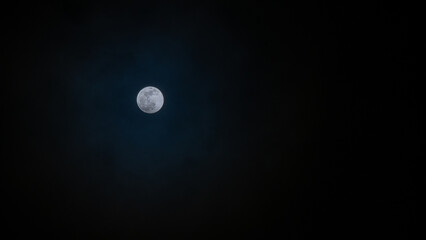 full moon over blue sky