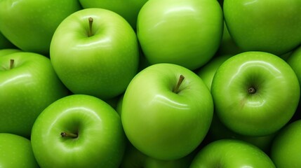 a pile of green apples with one green apple in the middle of the pile and one green apple in the middle of the pile in the middle of the pile.