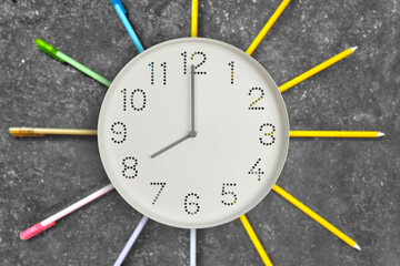 8 o'clock. Study or business time. Clock  with white clock face on dark background with rays of...