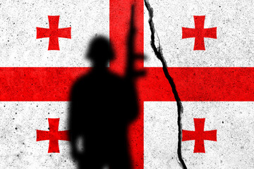 Georgians flag on the cracked concrete wall with soldier