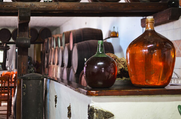 Old wine bottles in the cellar of the winemaking factory.