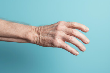 The palm of an elderly grandfather, showcasing a swollen vein and joint, illustrating common health problems in the elderly.
