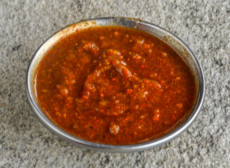 Spicy and sweet Chutney or sauce served in dish isolated on grey background side view of indian spices and pakistani food