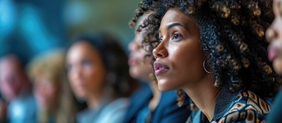 Fototapeta premium White woman attending HR forum, paying attention to speaker discussing social studies.