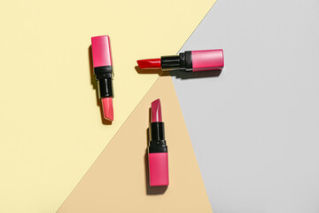 Composition with beautiful lipsticks on color background