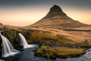 Spectacular view of the waterfall in front of Kirkjufell at sunrise,  Iceland