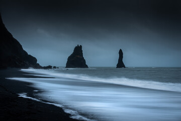 Black basalt sea stacks in Reynisfjara Black Beach, Vik,  Iceland
