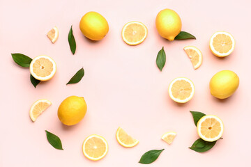 Frame made of fresh lemons on pink background