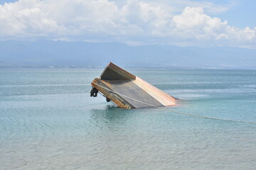 Capsized Sand Transporter Ship in Palu Bay Water